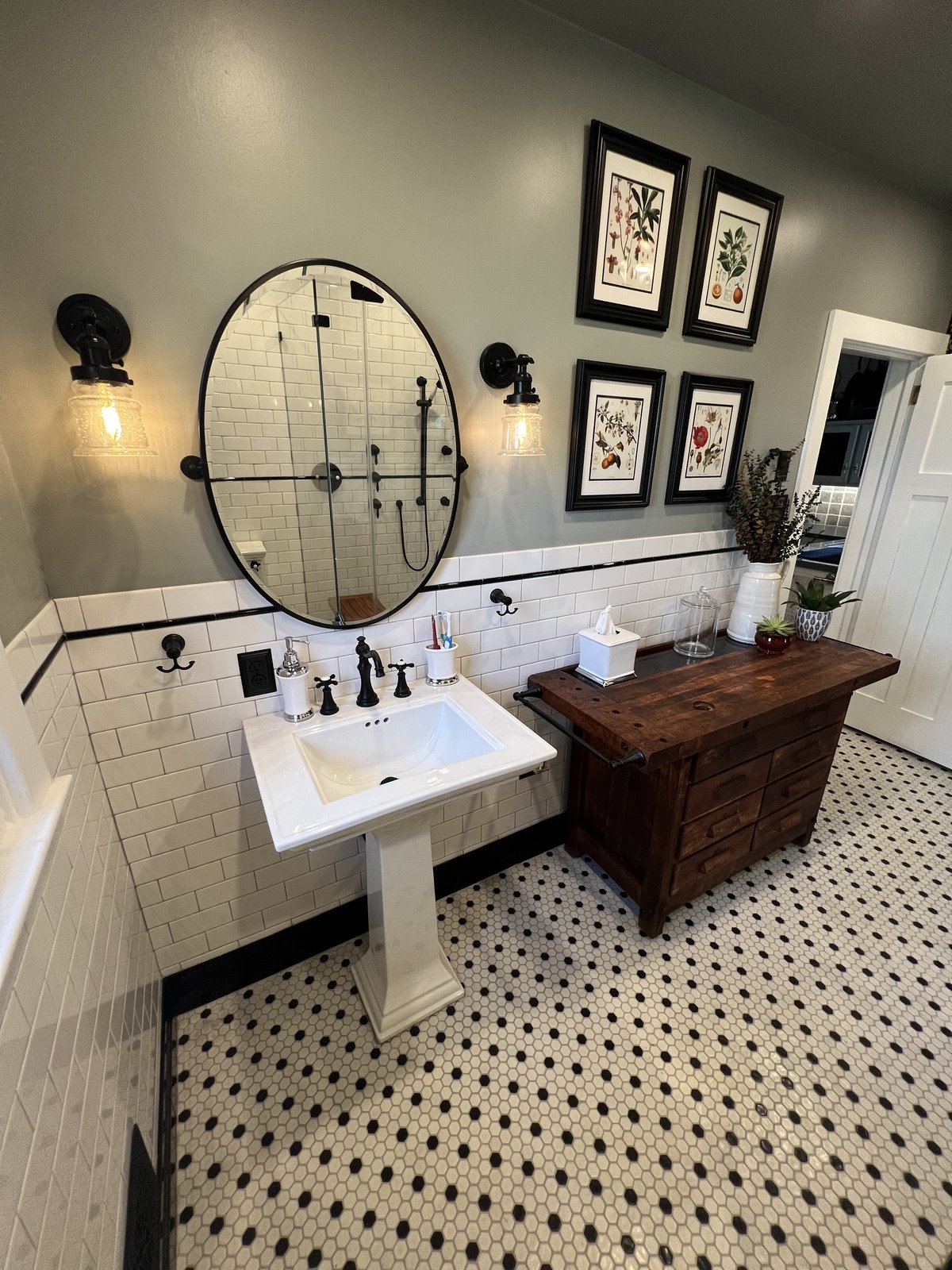 Custom bathroom remodel with pedestal sink and penny-tile floor by Cavacini Custom Remodel, West Chester PA