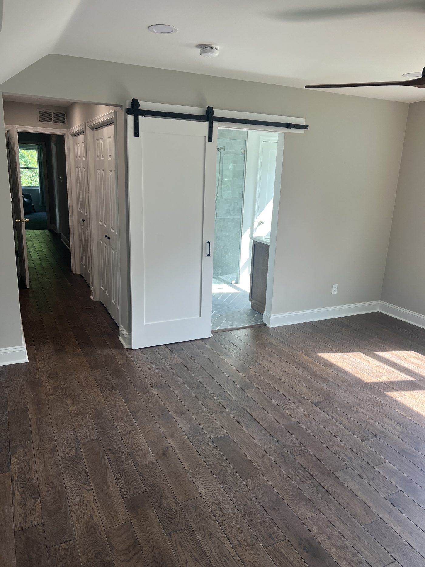 Finished living space with hardwood floors and barn door, West Chester PA