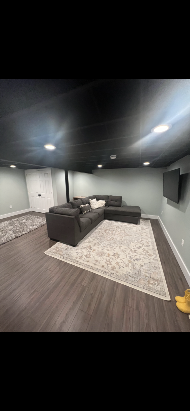 Finished basement with sectional living area and recessed lighting, Delaware County PA